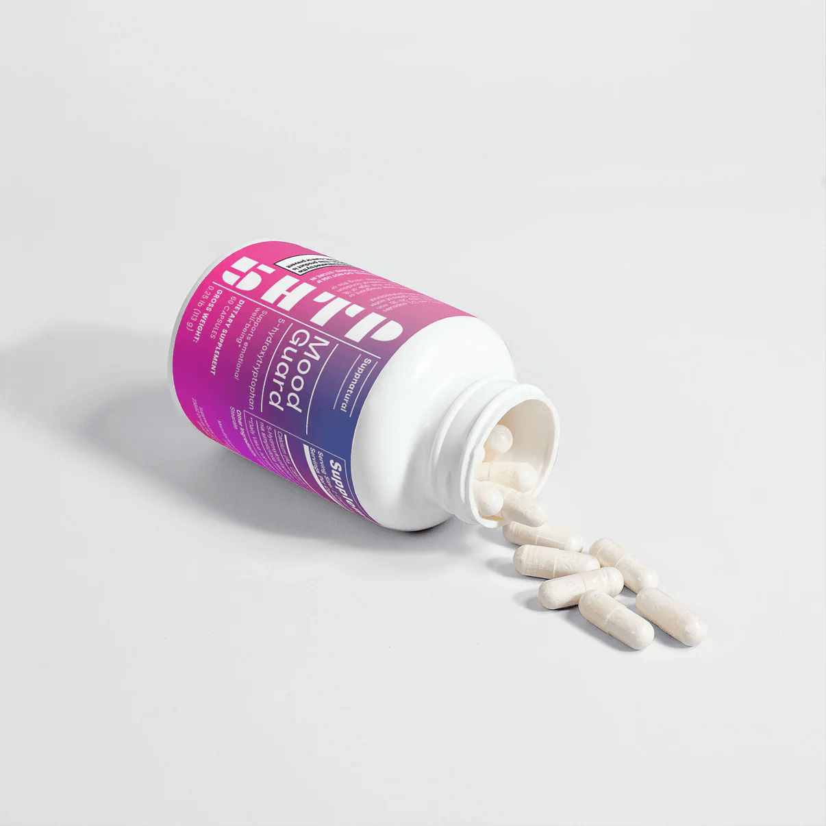 Open Mood Guard 5-HTP supplement bottle with visible capsules