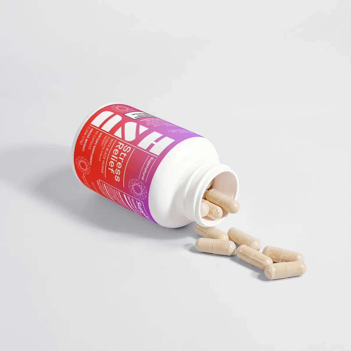 Ash Stress Relief Capsules bottle open with capsules on white surface